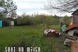участок по адресу Мельниківська
