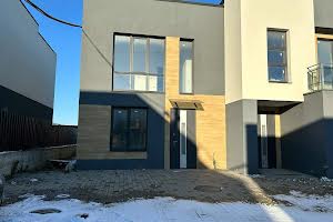 дом по адресу Коновальця