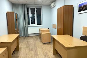 комерційна за адресою Євгена Коновальця вул. (Щорса), 32-Г