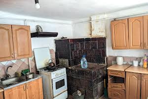 будинок за адресою Рогатин, Могили, 38